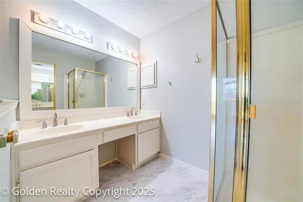 a bathroom with a double vanity sink mirror and double