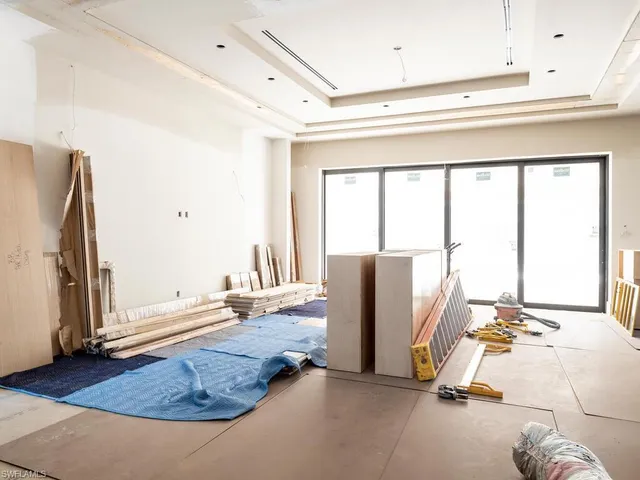 a view of a kitchen with a large window