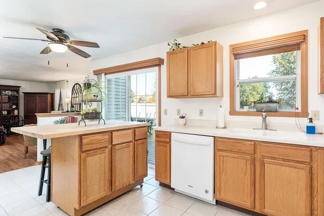 a kitchen with sink cabinets and window