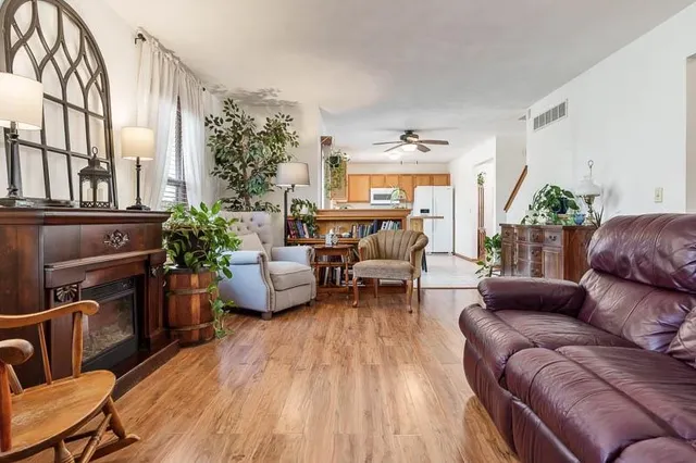 a living room with furniture and a fireplace