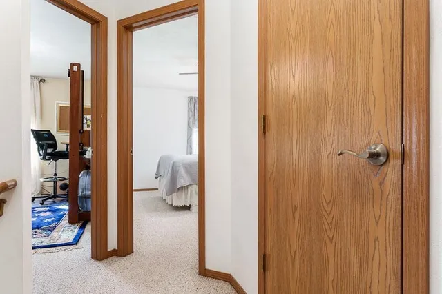 a bedroom with furniture and a rug