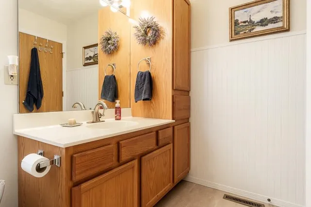 a white toilet sitting next to a shower curtain