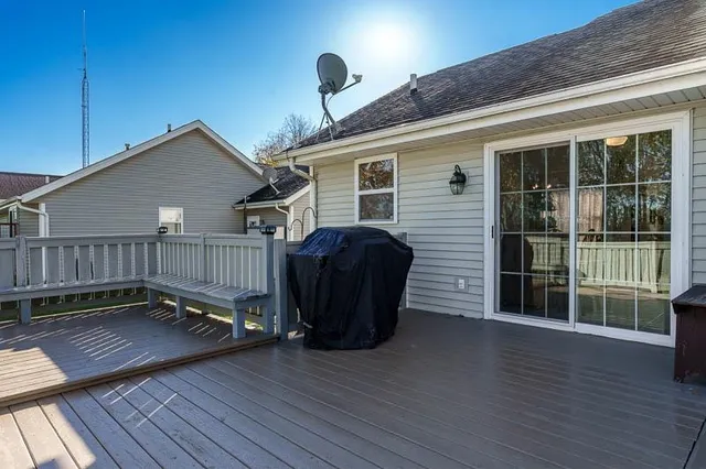 a view of a wooden deck with a bench