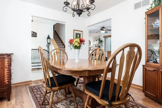 a view of a dining room with furniture and window
