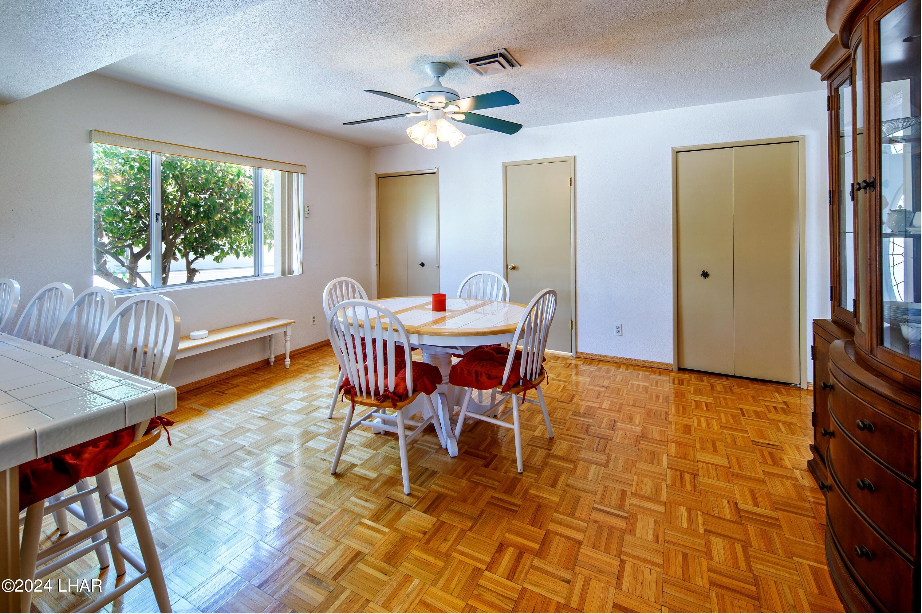 8702 Papago Loop Parker, AZ 85344 - Photo 18 of 36 a dining room with furniture and window