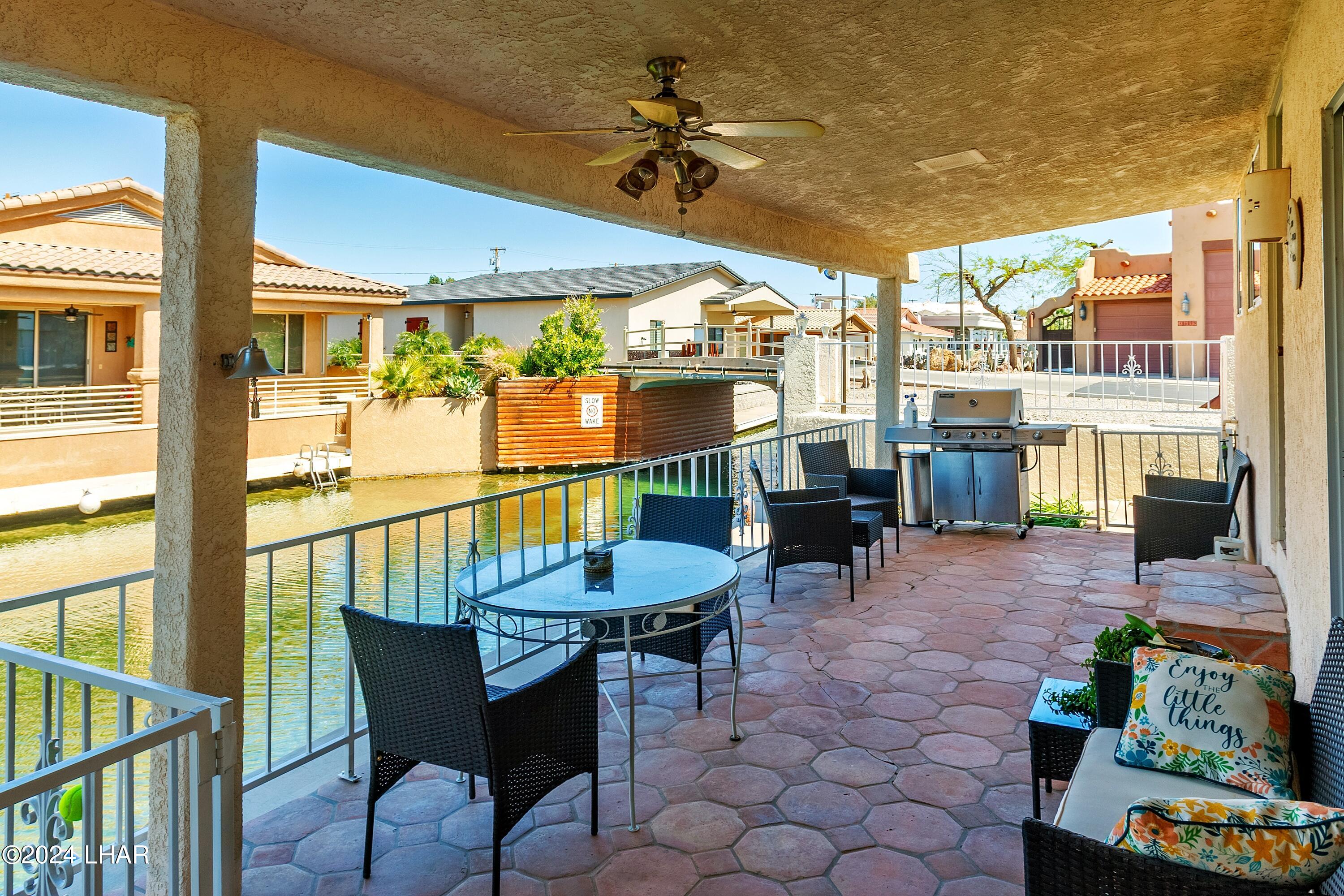 8702 Papago Loop Parker, AZ 85344 - Photo 2 of 36 a view of an outdoor dining space with furniture