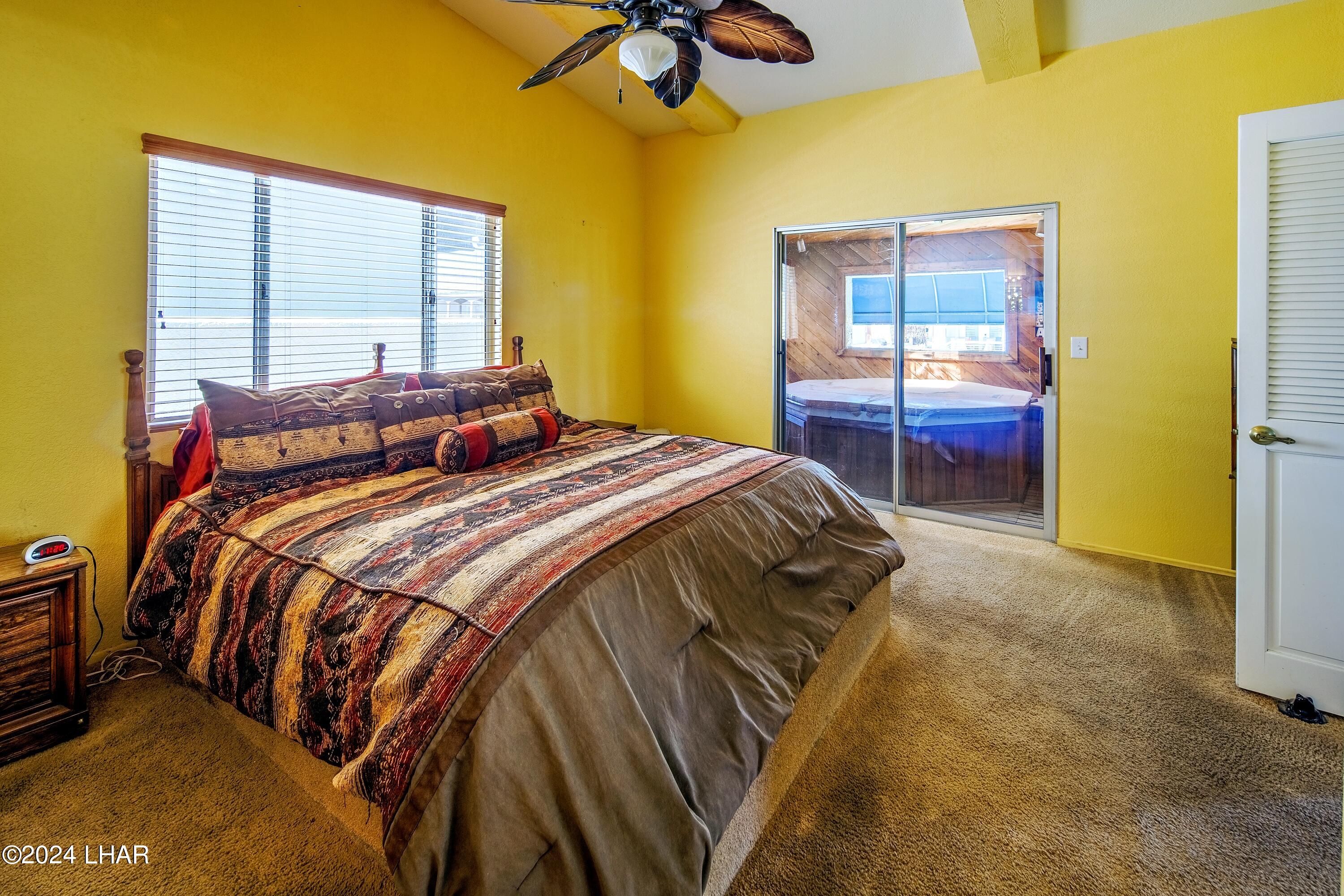 8702 Papago Loop Parker, AZ 85344 - Photo 25 of 36 a bedroom with a bed and a window