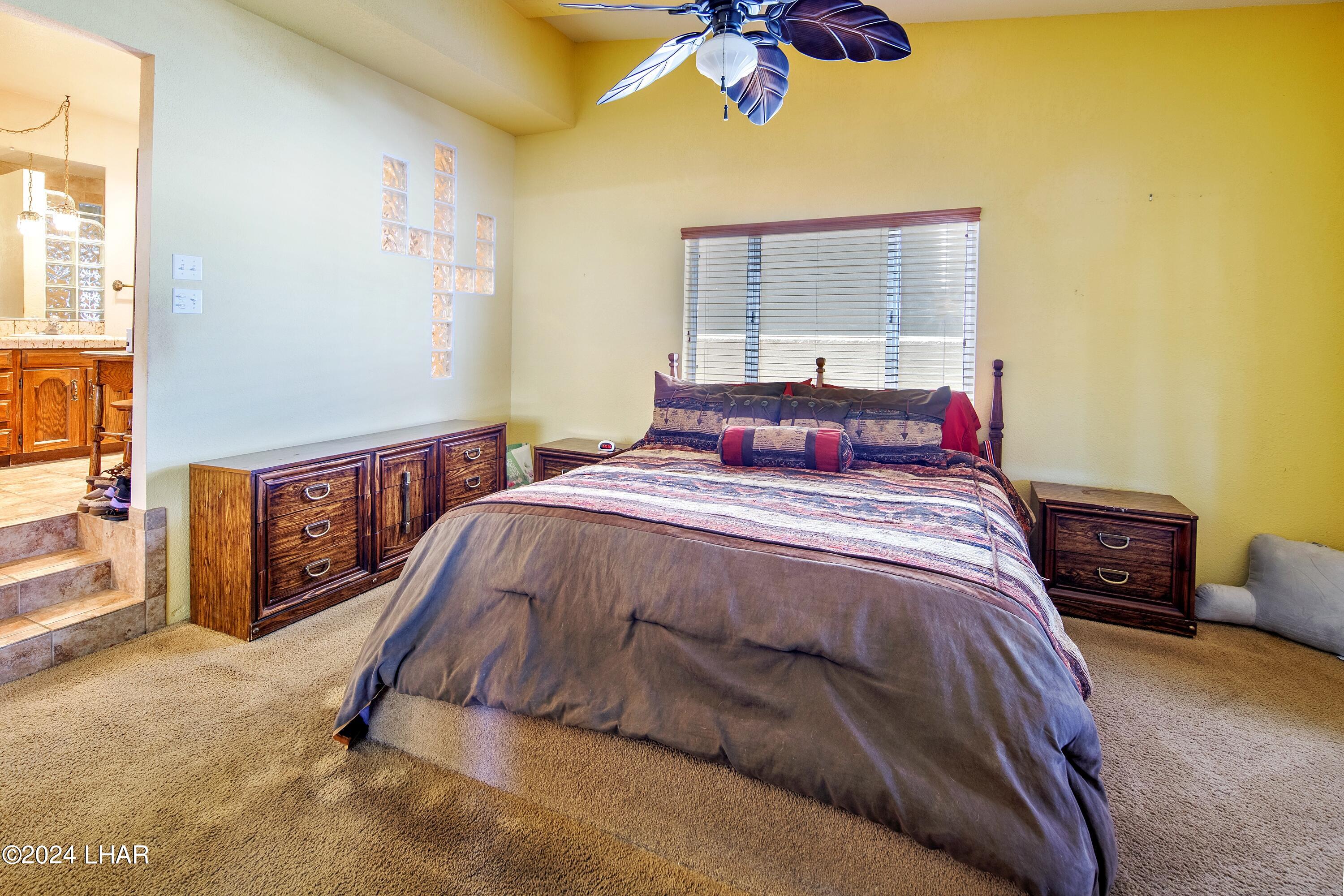 8702 Papago Loop Parker, AZ 85344 - Photo 26 of 36 a bedroom with a bed and a window