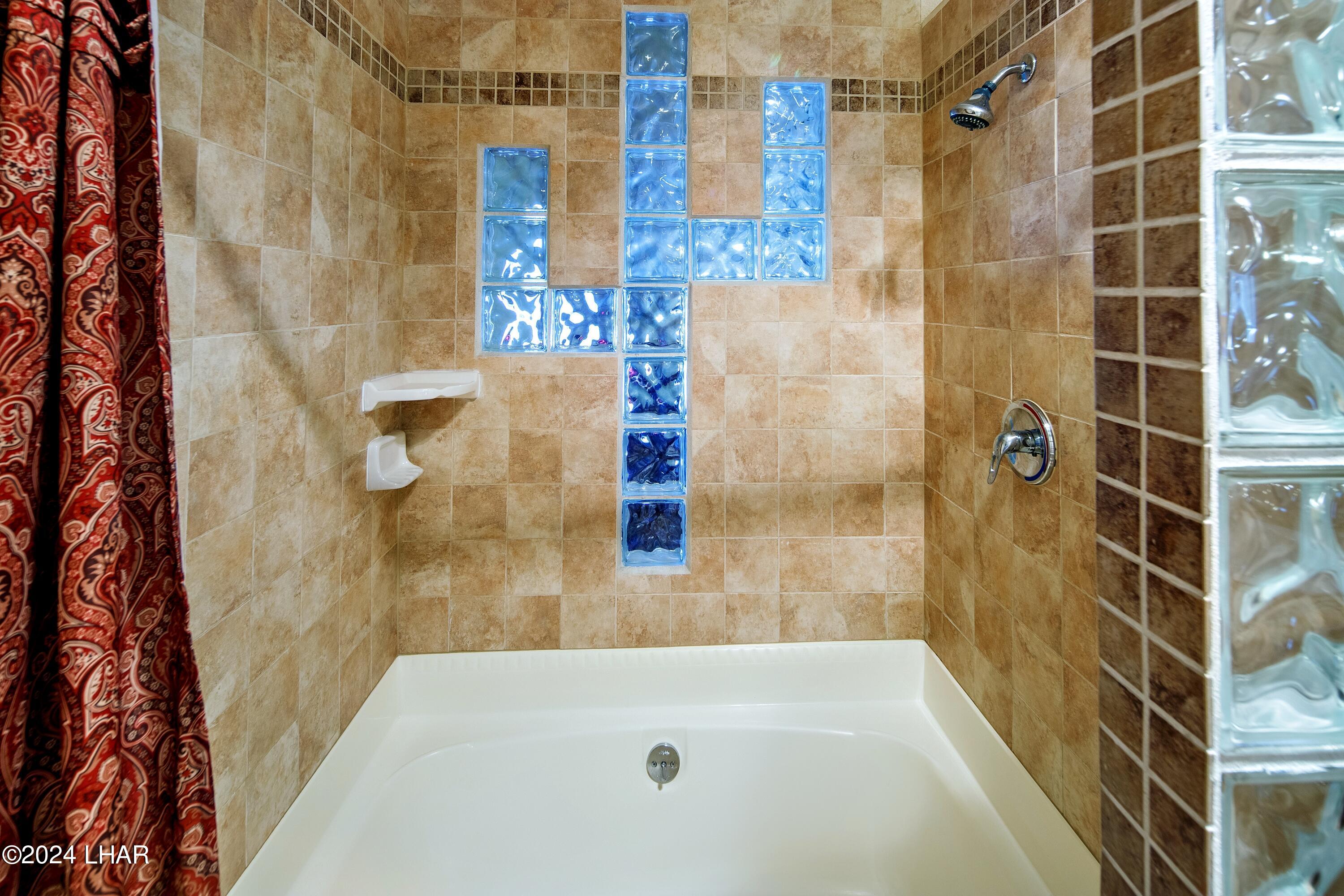 8702 Papago Loop Parker, AZ 85344 - Photo 28 of 36 a bathroom with a bathtub