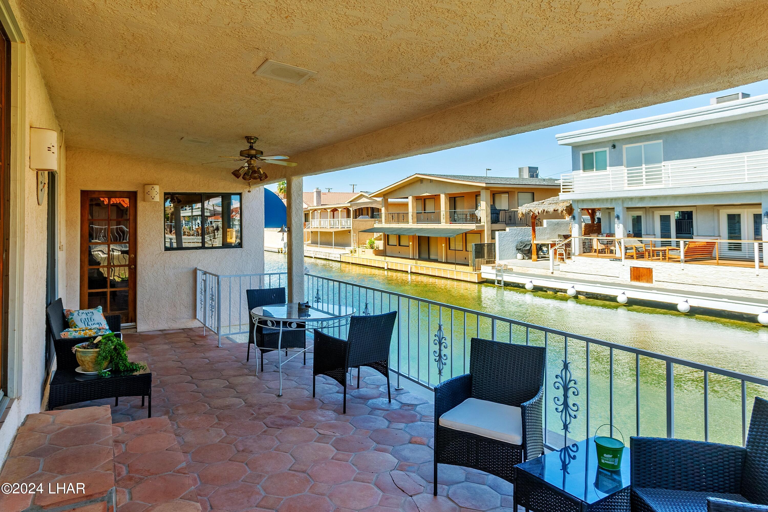 8702 Papago Loop Parker, AZ 85344 - Photo 3 of 36 a view of a chairs and table in the balcony