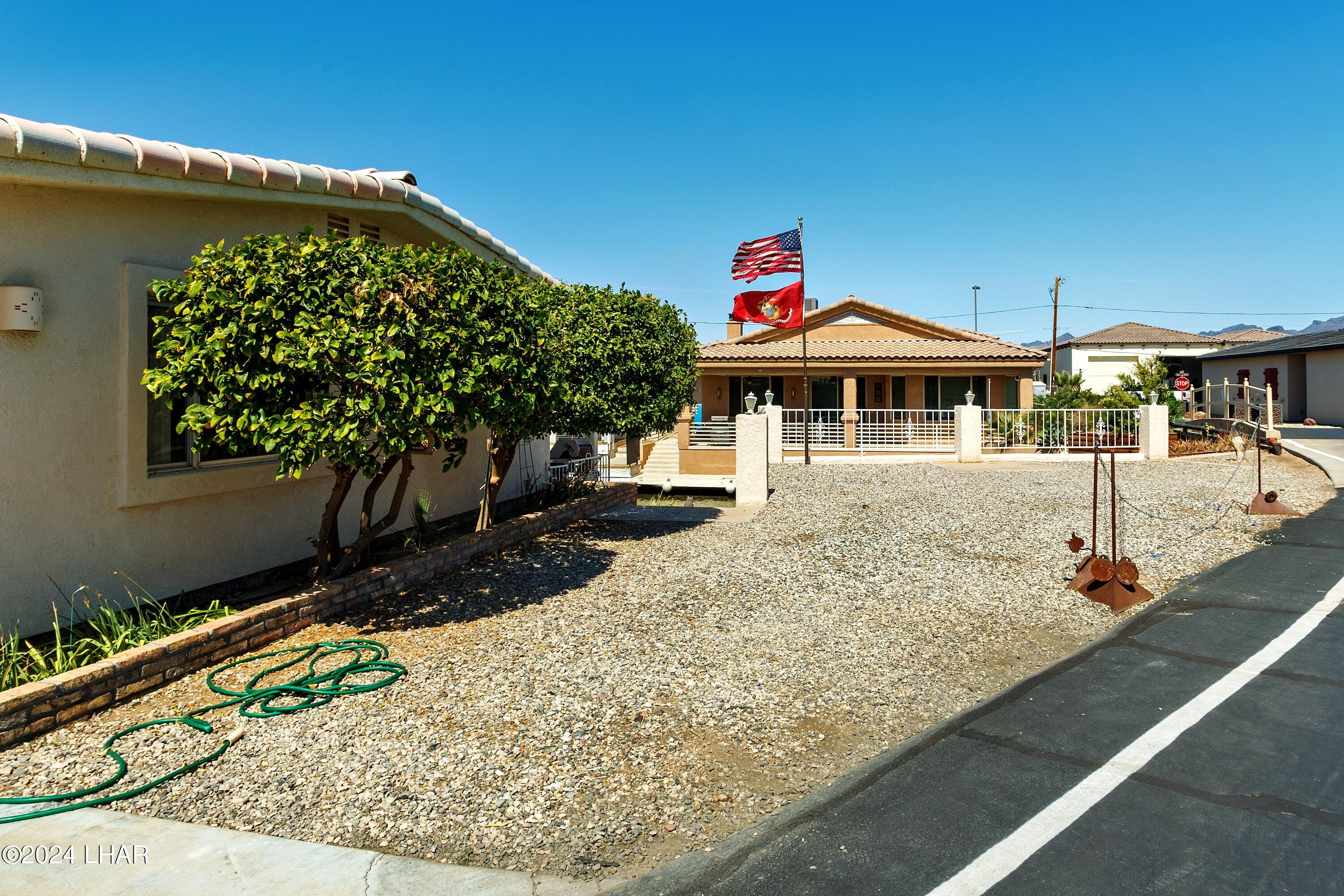 8702 Papago Loop Parker, AZ 85344 - Photo 10 of 36 a front view of a house with garden