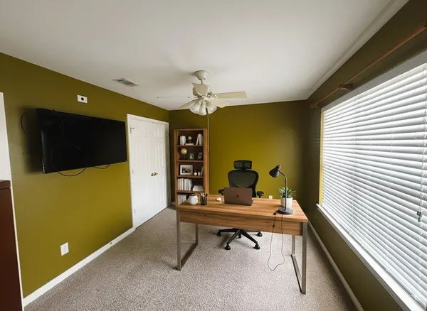 a living room with furniture and a window