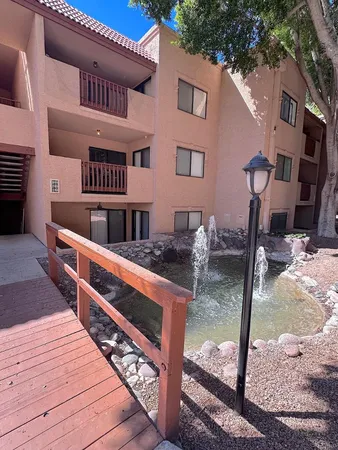 a front view of a house with parking area