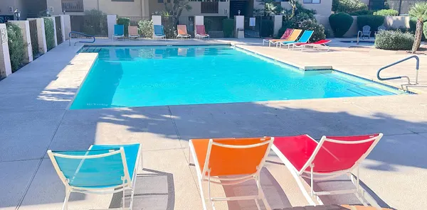 a view of swimming pool with seating area