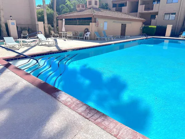 a view of swimming pool with outdoor seating