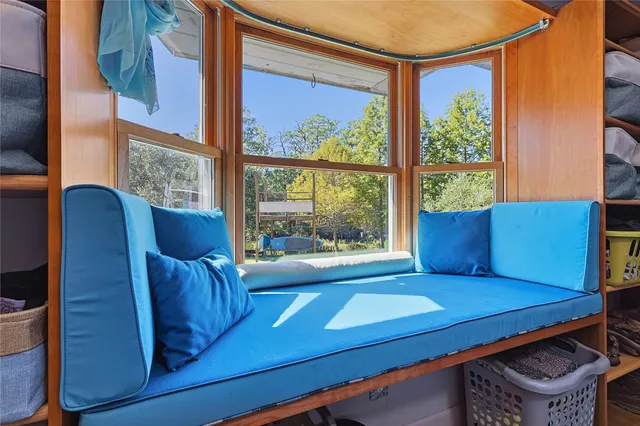 a white bath tub sitting next to a white toilet