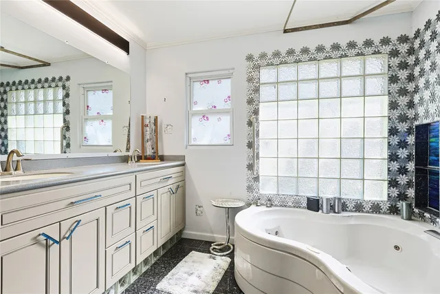 a house view with a sitting space and garden space