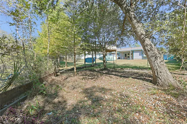 a house with trees in front of it