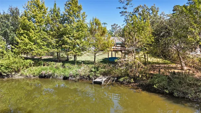 a front view of house with yard and outdoor seating