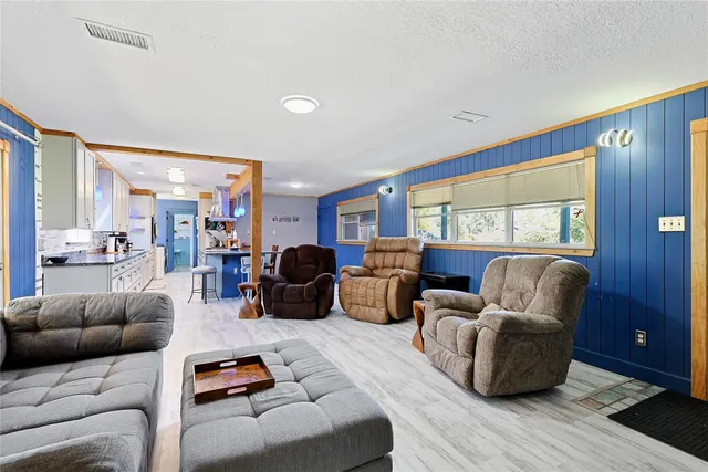 a living room with furniture or outdoor view and a large window