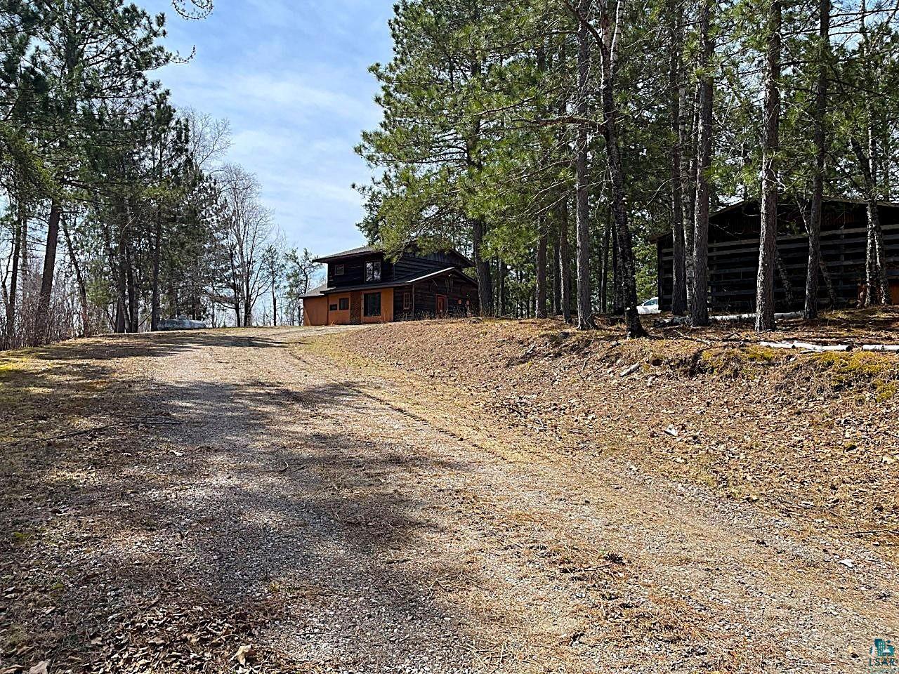 1480 Maijala Road Ely, MN 55731 - Photo 1 of 58 Gravel driveway leading to a cozy home atop the hill with panoramic views.