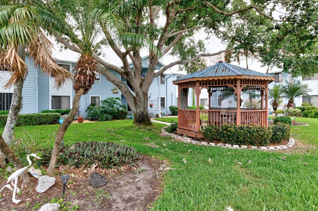 9637 Riverside Drive, Unit 3 Sebastian, FL 32958 - Photo 29 of 36 a front view of a house with a yard