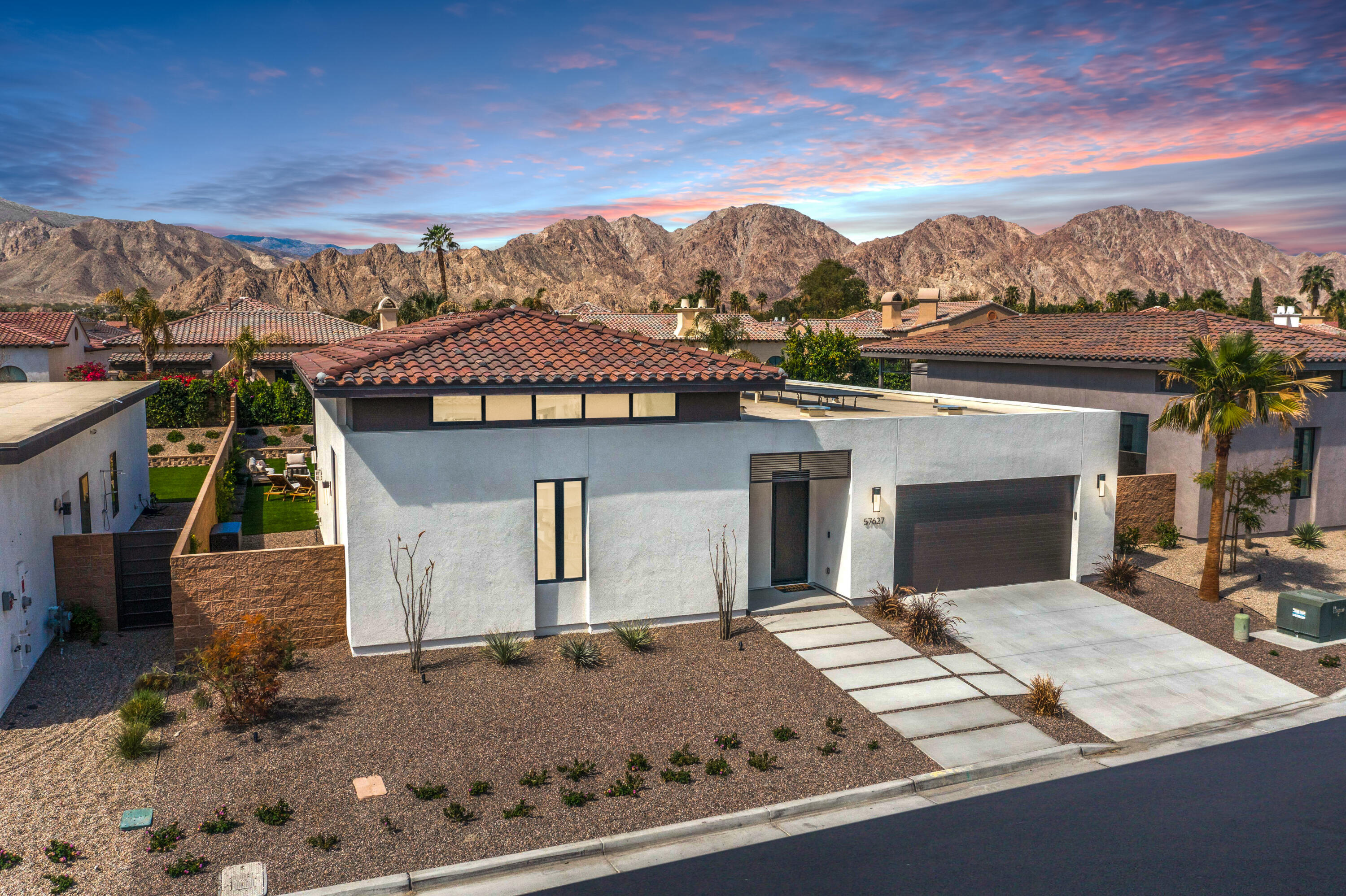 57627 Santo Thomas La Quinta, CA 92253 - Photo 1 of 37 front view of a house with a yard