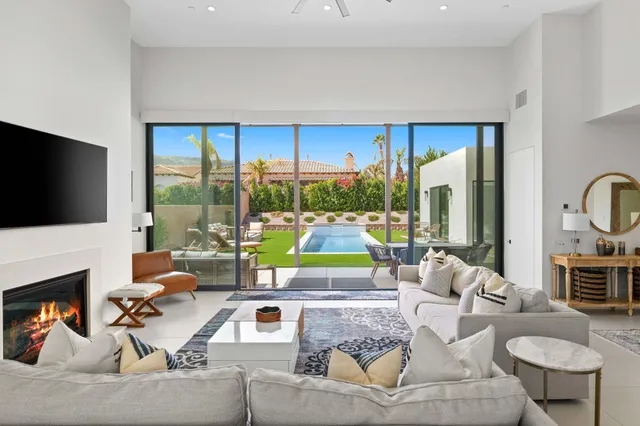 a living room with fireplace furniture and a flat screen tv
