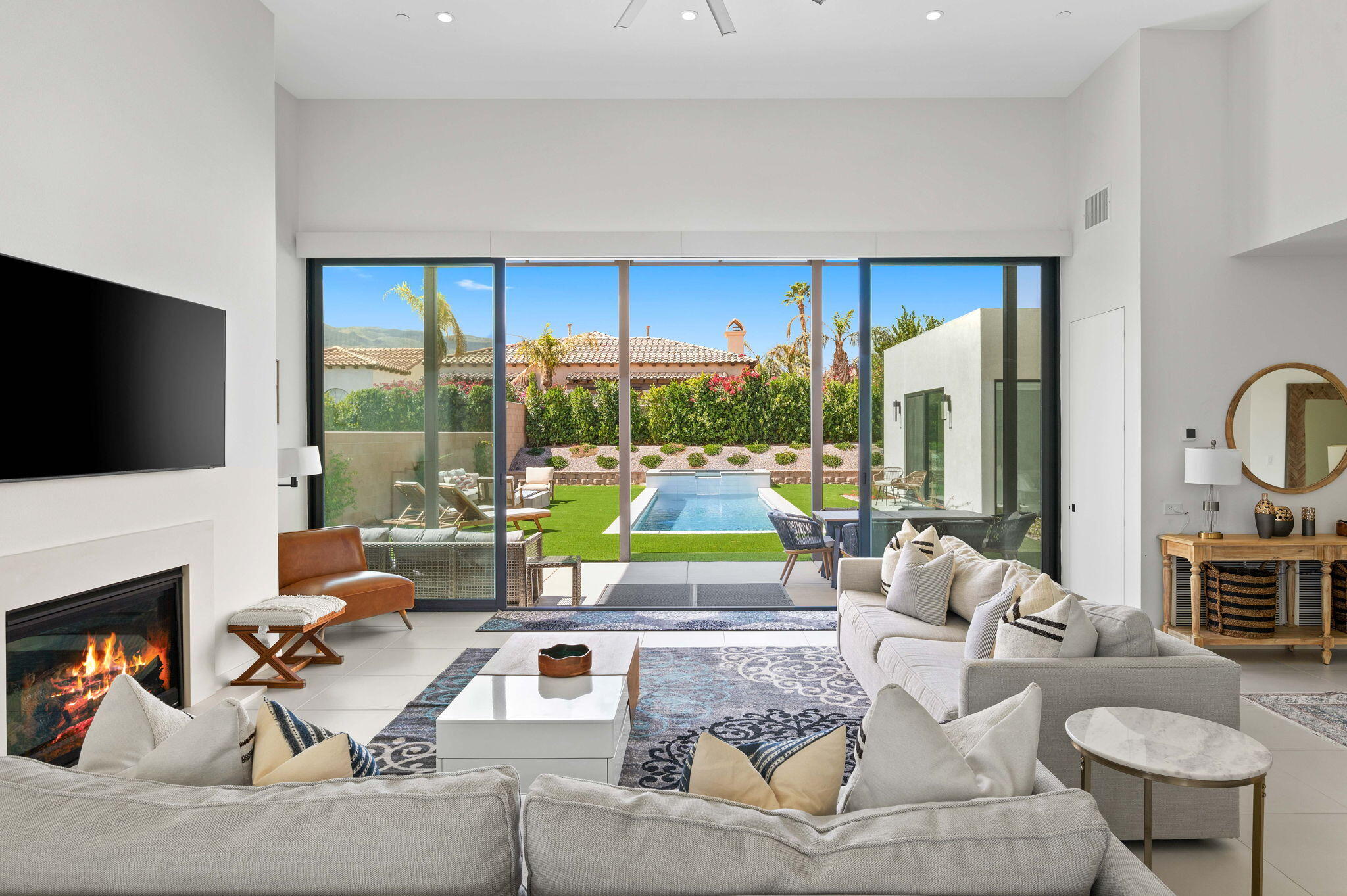 57627 Santo Thomas La Quinta, CA 92253 - Photo 13 of 37 a living room with fireplace furniture and a flat screen tv