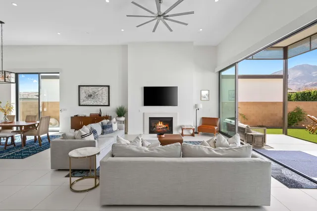 a living room with fireplace furniture and a flat screen tv