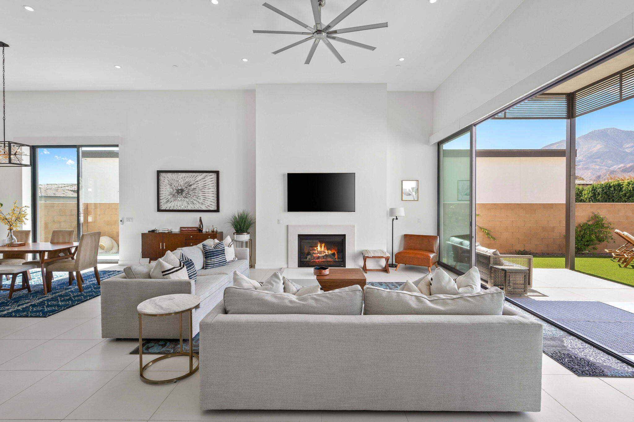 57627 Santo Thomas La Quinta, CA 92253 - Photo 15 of 37 a living room with fireplace furniture and a flat screen tv