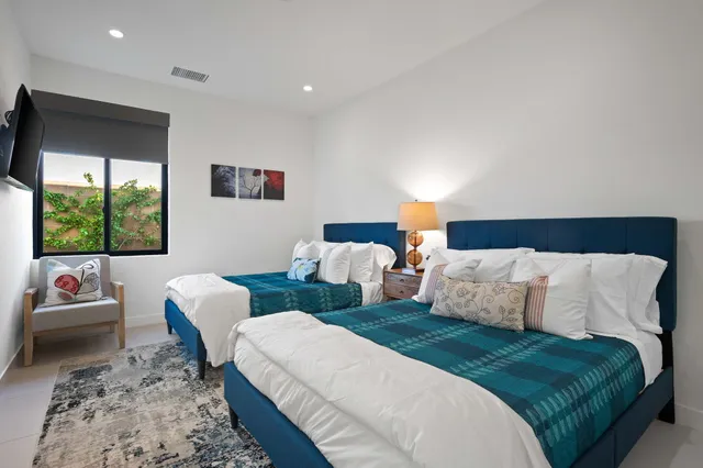 a bedroom with a bed and a couch