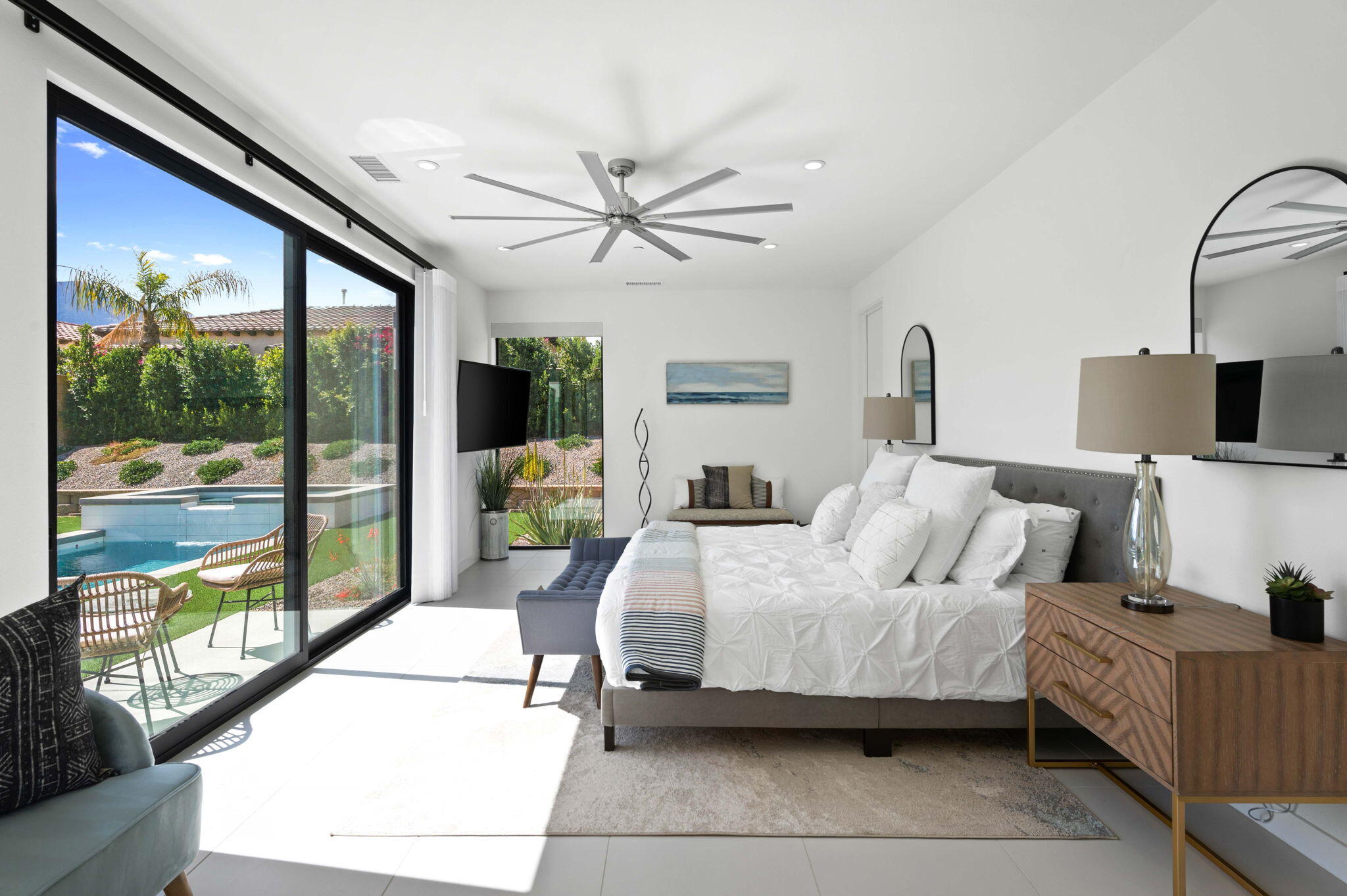 57627 Santo Thomas La Quinta, CA 92253 - Photo 24 of 37 a bedroom with a balcony a bed and a large window