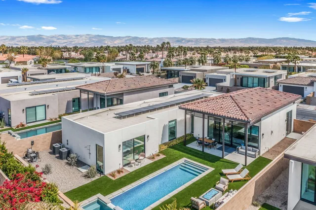 an aerial view of a house with a big yard