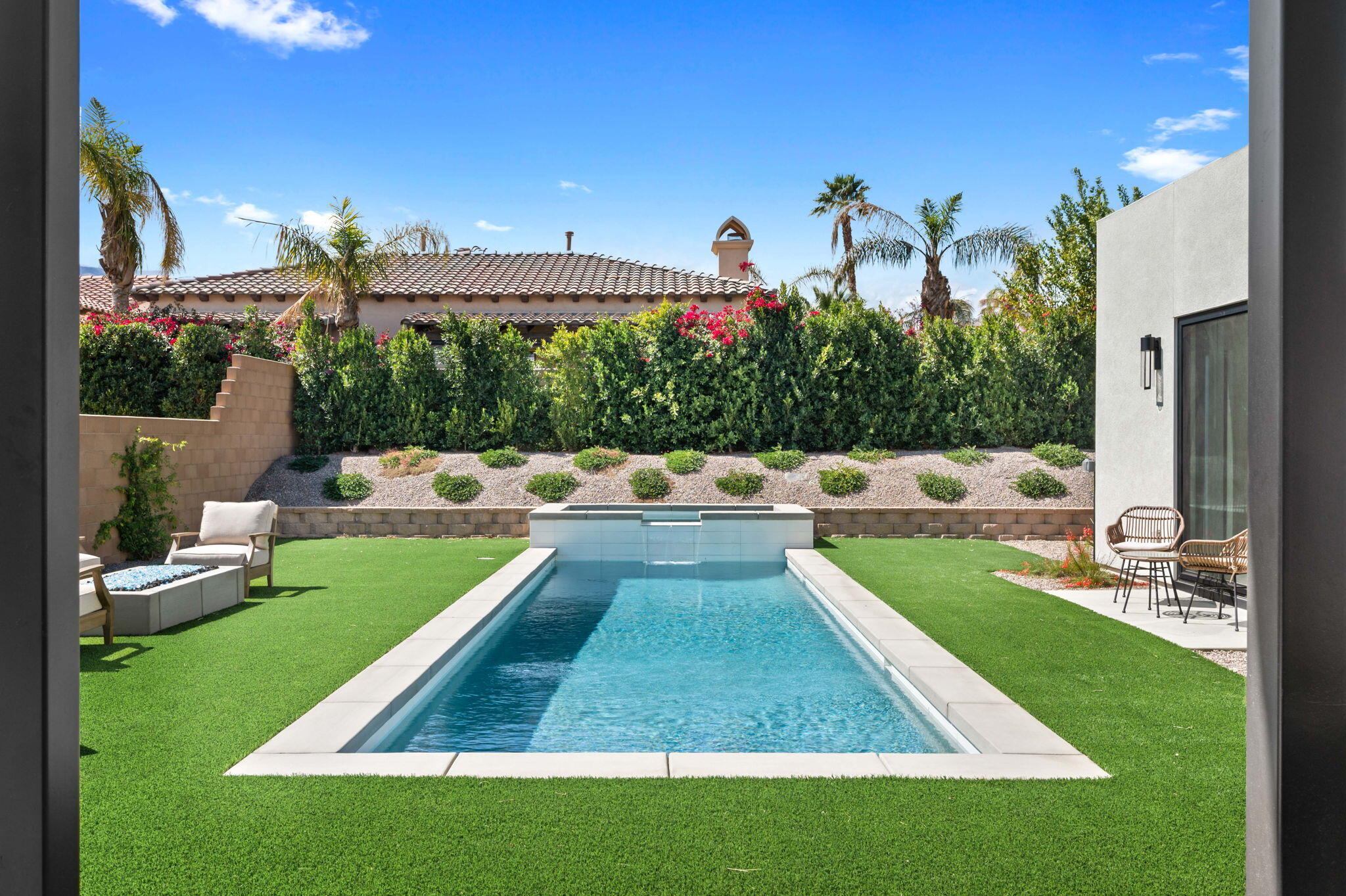 57627 Santo Thomas La Quinta, CA 92253 - Photo 33 of 37 a view of a swimming pool with a patio and a yard