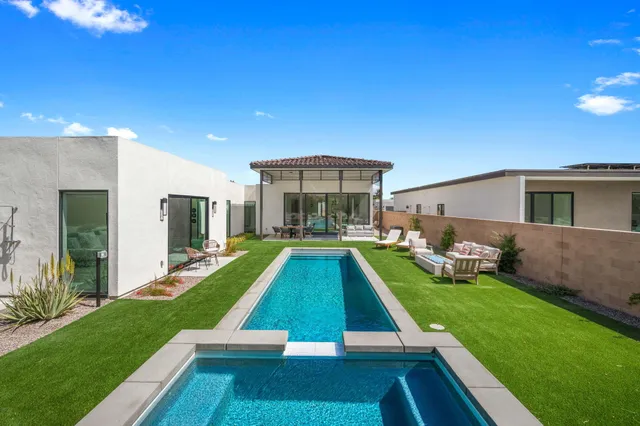 a view of swimming pool with a backyard