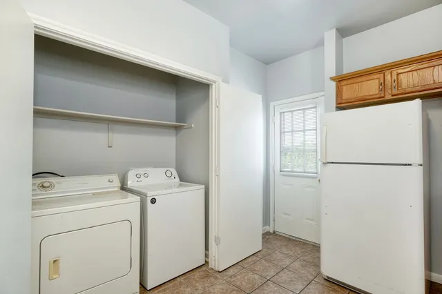 a utility room with dryer and washer