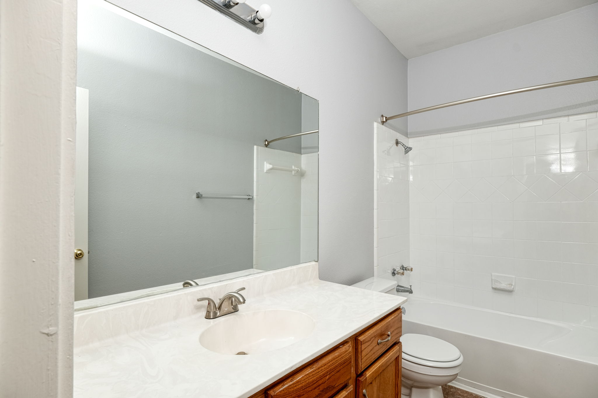 2802 Southampton Way, Unit A Round Rock, TX 78664 - Photo 10 of 13 Full bathroom with washtub / shower combination and vanity