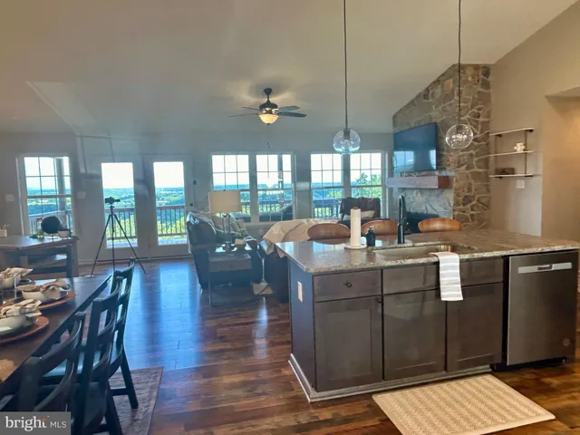 a kitchen with counter space dining table and chairs