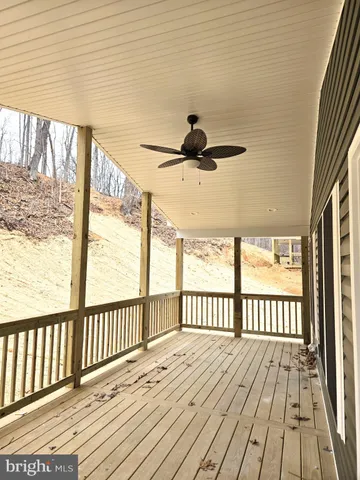 a view of a balcony with wooden floor
