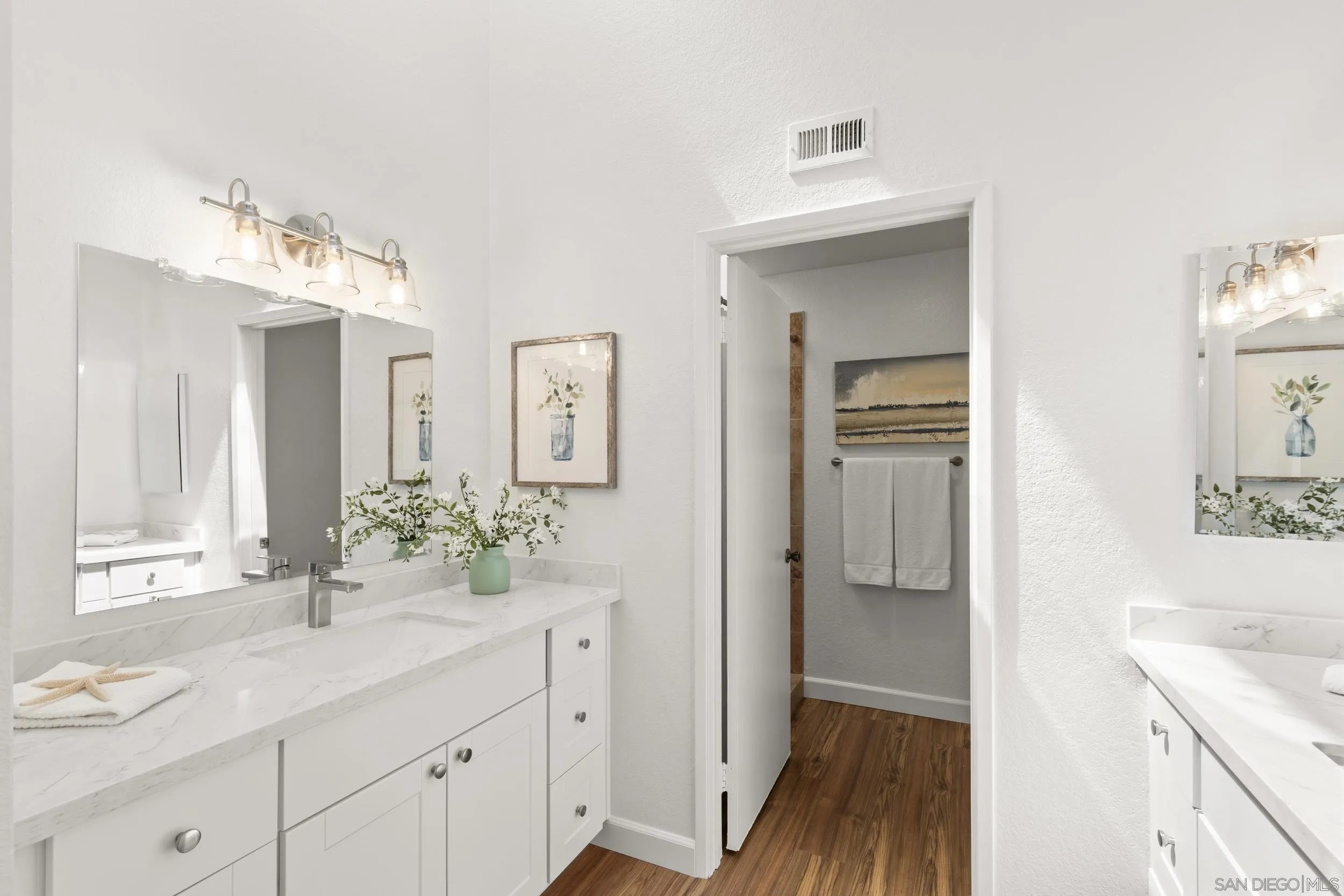 863 Violet Court Carlsbad, CA 92011 - Photo 19 of 37 a bathroom with a sink vanity granite and a mirror