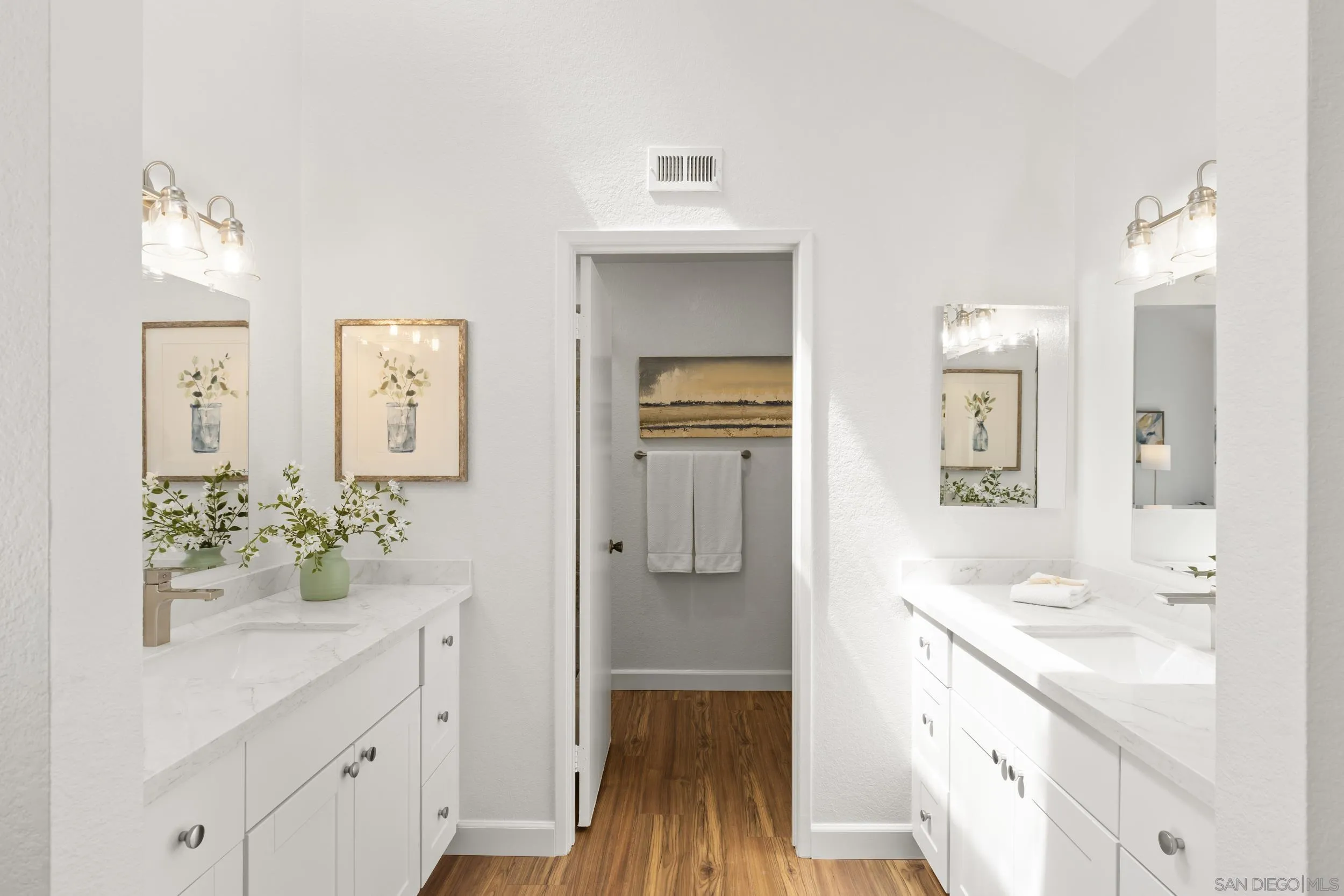 863 Violet Court Carlsbad, CA 92011 - Photo 20 of 37 a bathroom with a sink vanity and a mirror
