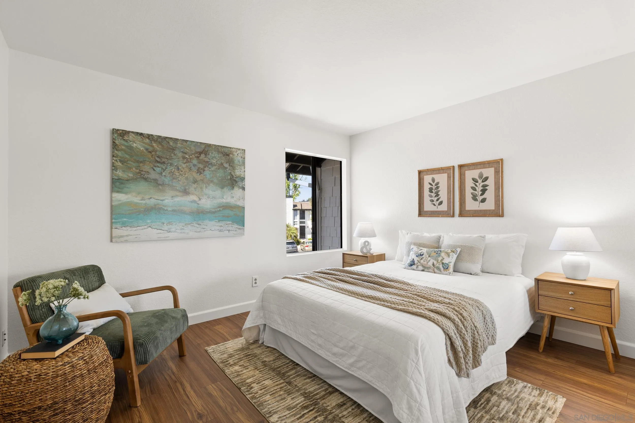 863 Violet Court Carlsbad, CA 92011 - Photo 22 of 37 a bedroom with a bed and wooden floor