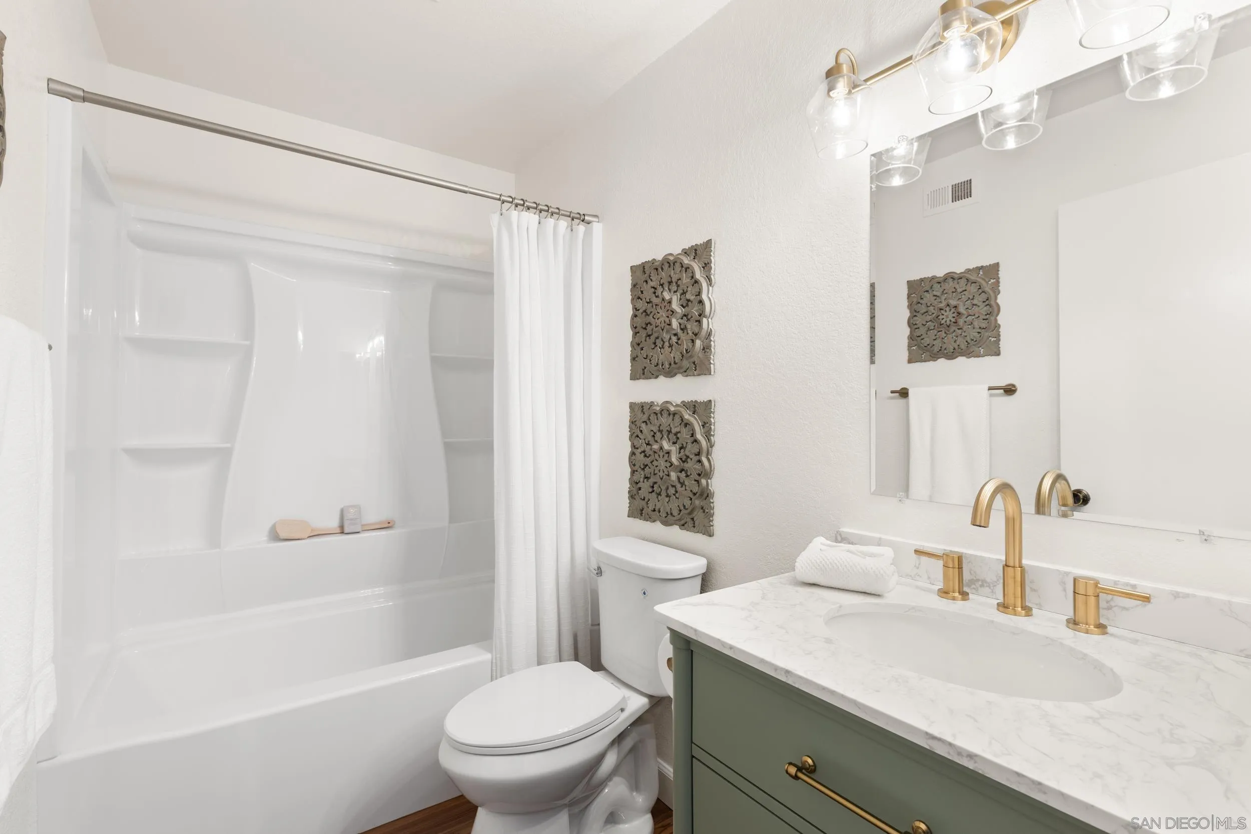863 Violet Court Carlsbad, CA 92011 - Photo 23 of 37 a bathroom with a sink a toilet and shower
