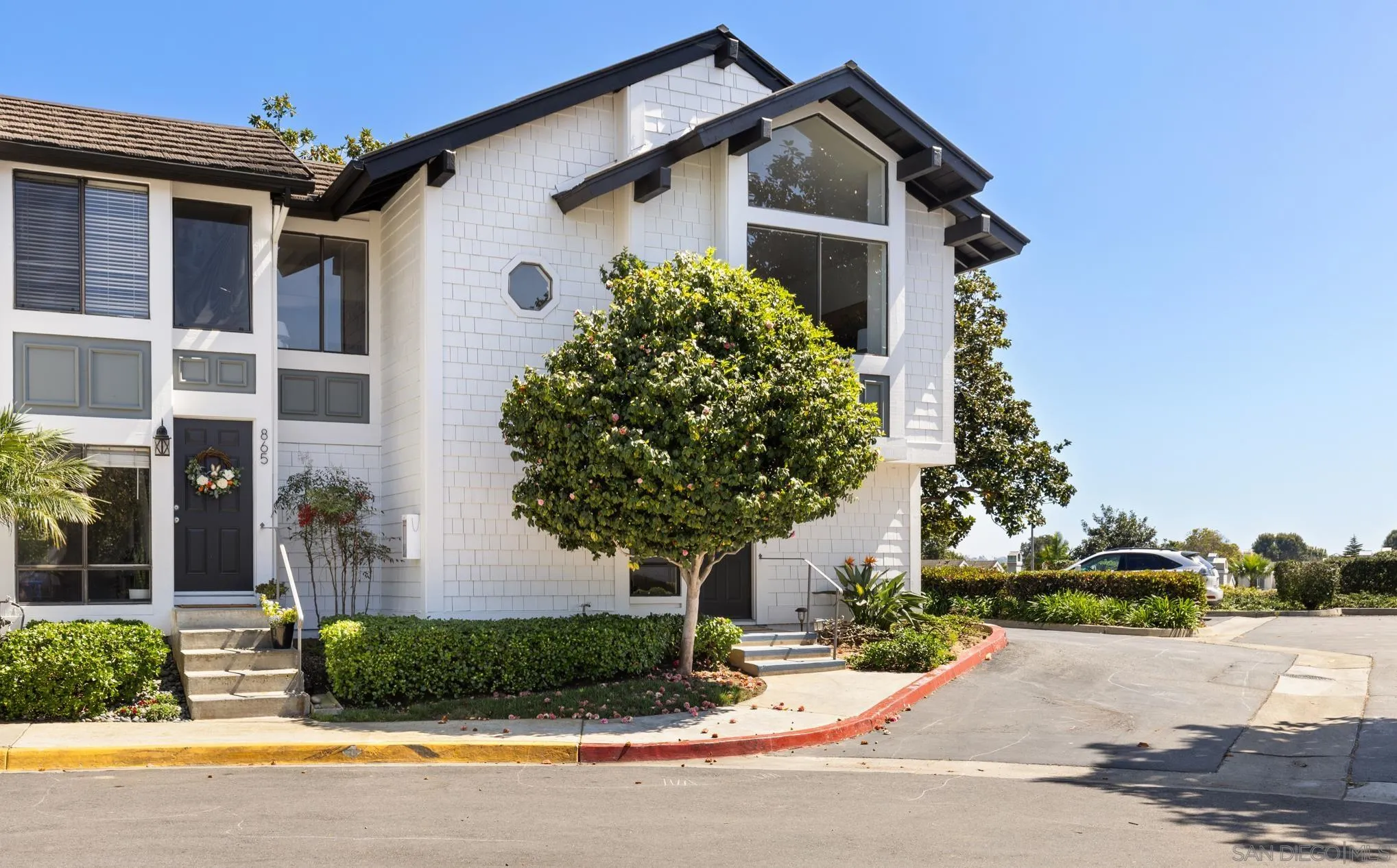 863 Violet Court Carlsbad, CA 92011 - Photo 25 of 37 a front view of a house with garden
