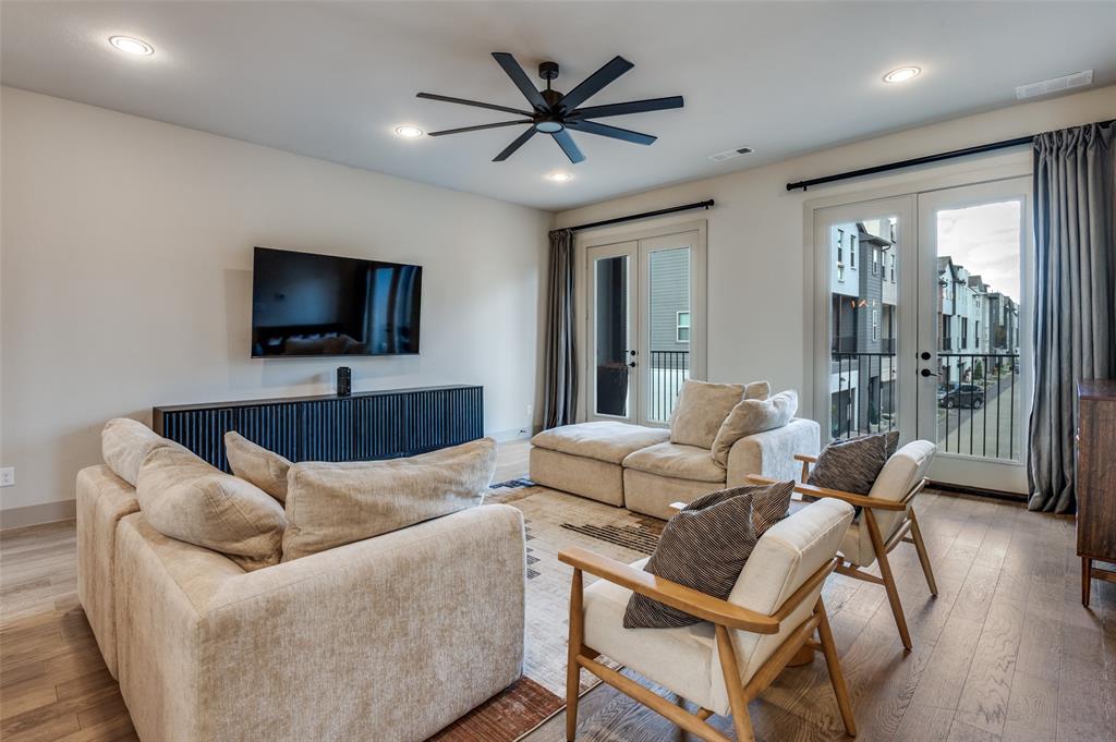 1434 Elevado Drive Dallas, TX 75212 - Photo 12 of 27 a living room with furniture and a flat screen tv