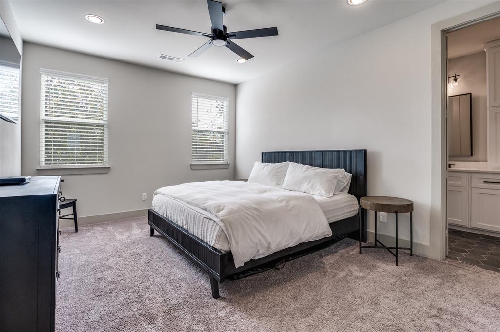 1434 Elevado Drive Dallas, TX 75212 - Photo 18 of 27 a bed sitting in a spacious bedroom next to a window