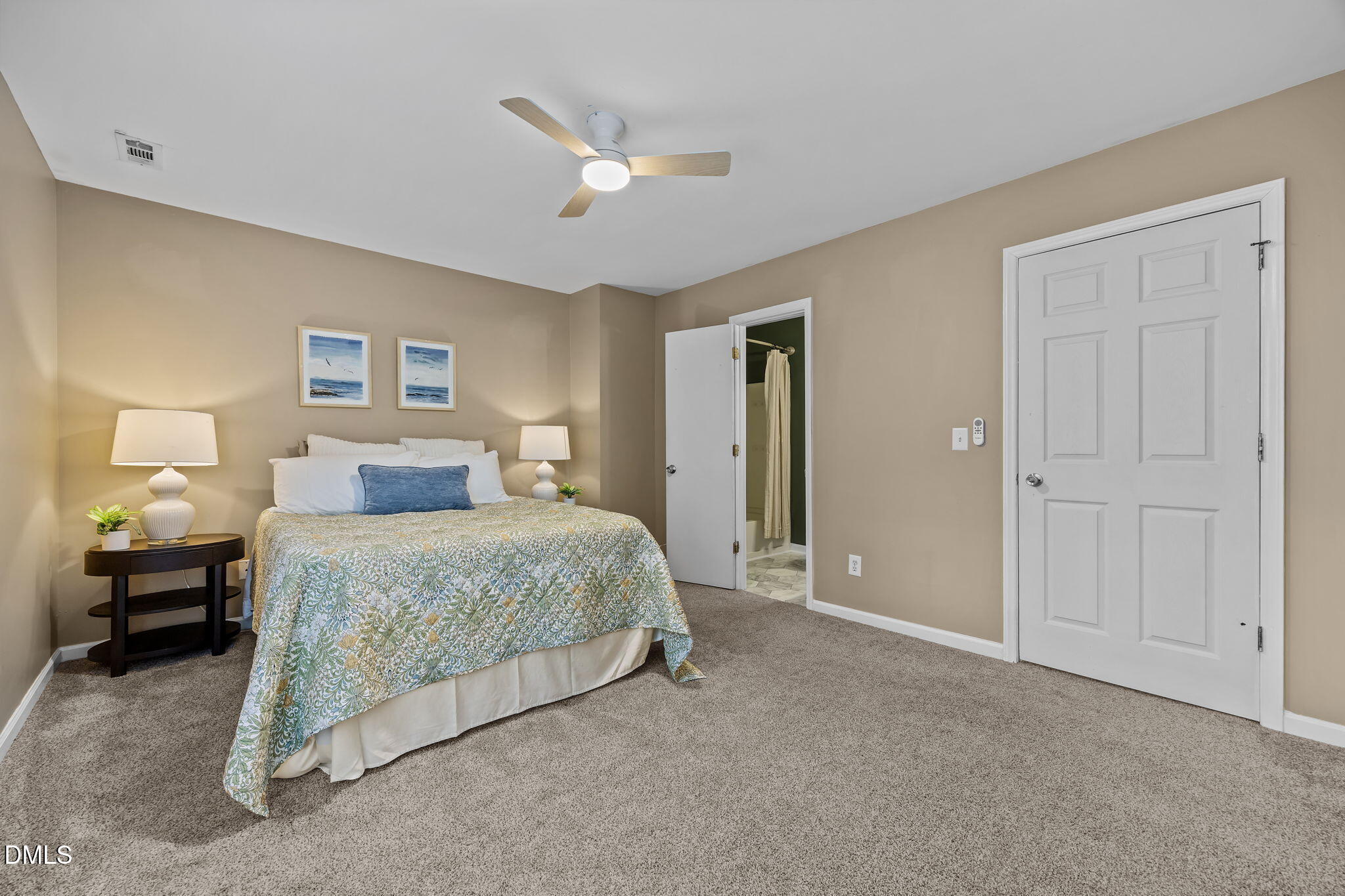 8606 London Park Court Raleigh, NC 27615 - Photo 11 of 29 a bedroom with a bed and a chandelier