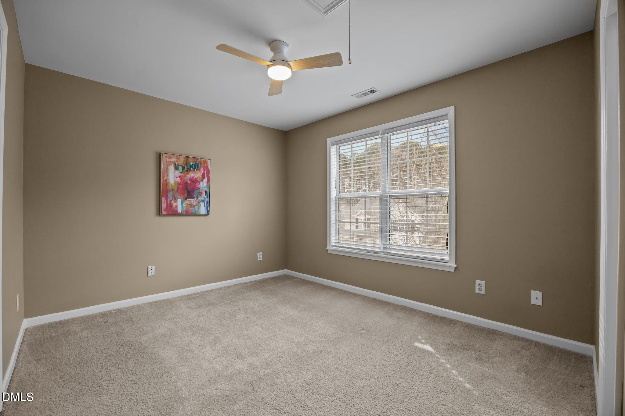 8606 London Park Court Raleigh, NC 27615 - Photo 15 of 29 an empty room with windows and fan