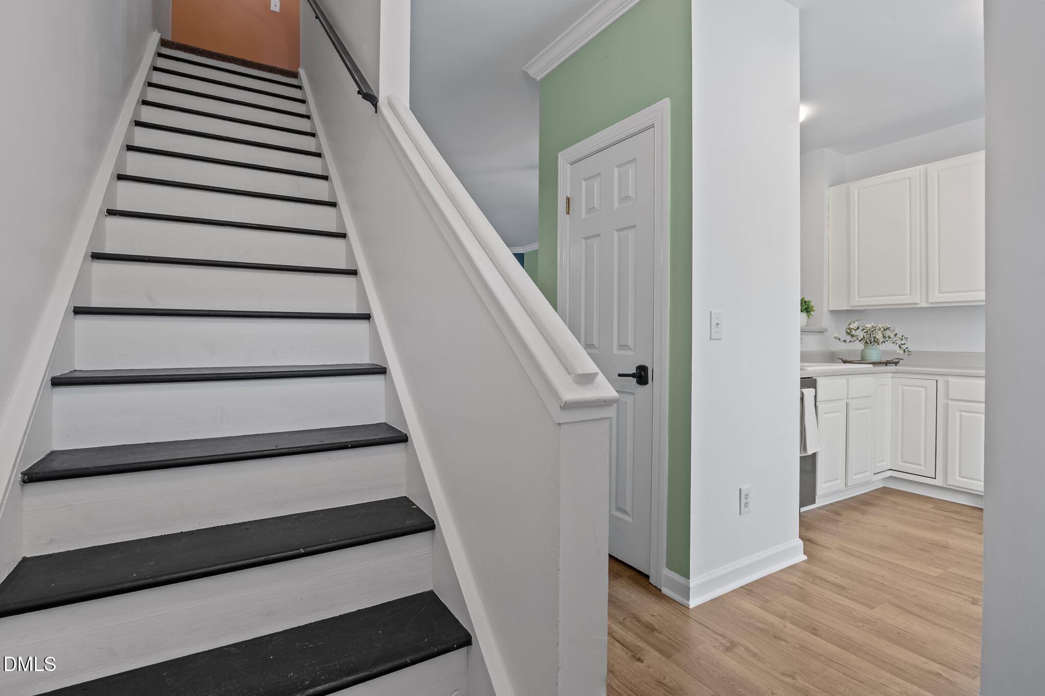 8606 London Park Court Raleigh, NC 27615 - Photo 21 of 29 a view of entryway and hall with wooden floor